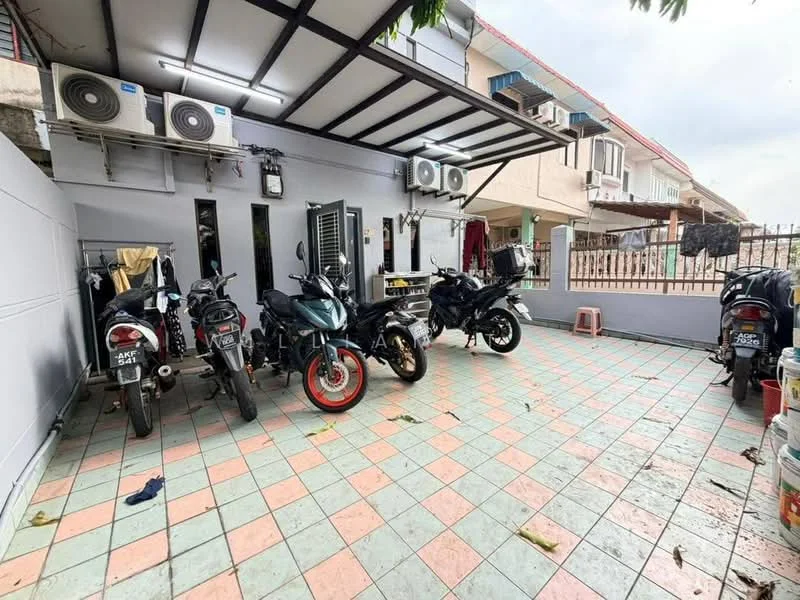 Exterior type: linked terrace house; features: covered car porch, paved flooring with colorful tiles, 3 wall-mounted split AC units, fenced perimeter, clothes drying area with hanging clothes, multiple motorcycles parked, access to residential area, outdoor lighting fixtures; style: modern.