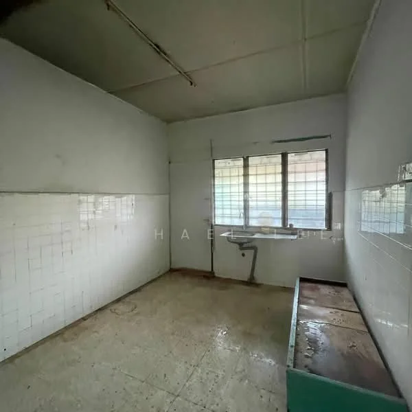 Room features: white painted walls, tile flooring, single window with grid pattern, sink with faucet, countertop with storage underneath, exposed ceiling, no visible appliances, minimal decor.