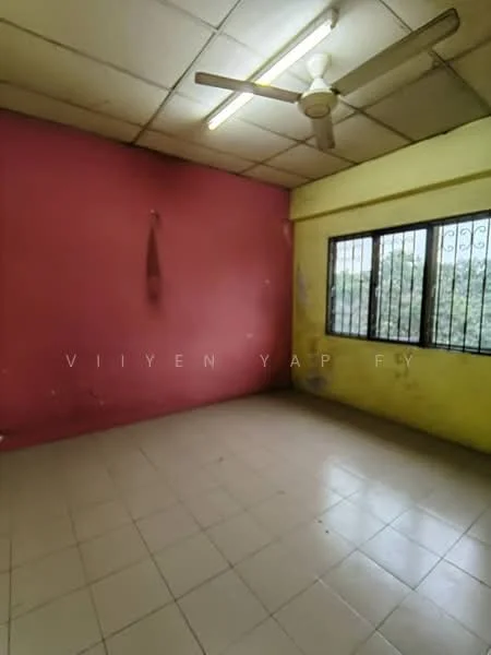 Room features: pink painted walls, yellow painted walls, ceiling fan, floor tiles, window with security bars, natural light from window.