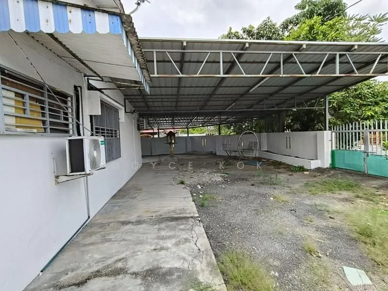 Exterior type: detached bungalow; features: covered car porch, concrete flooring, metal roof, fenced perimeter, landscaped garden area, air conditioning unit visible, gravel area, mature trees in background; style: modern.