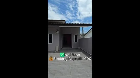 Exterior features: grey painted facade, flat roof with overhang, paved flooring, front porch area, single main entrance, surrounded by walls, clear blue sky; style: modern.