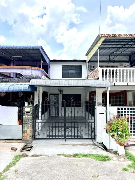 Exterior type: linked terrace house; features: white painted facade, black wrought iron gate, paved driveway, balcony with railing on upper floor, flat roof, manicured flower bed, brick wall, front porch area; style: modern.