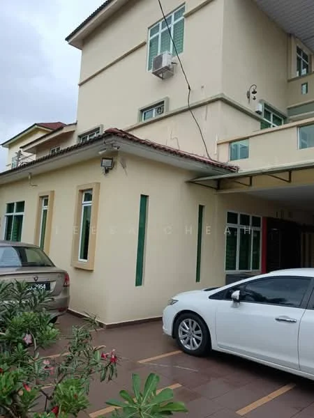 Exterior type: detached bungalow; features: cream painted facade, flat roof, 2-storey building, green windows, car porch with awning, manicured landscaping with plants, driveway with interlocking pavers, visible air conditioning unit; style: modern.