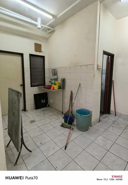 Laundry features: white tiled walls, white tiled flooring, sink, window, cleaning supplies, mop, broom, bucket, door, wall-mounted shelf.