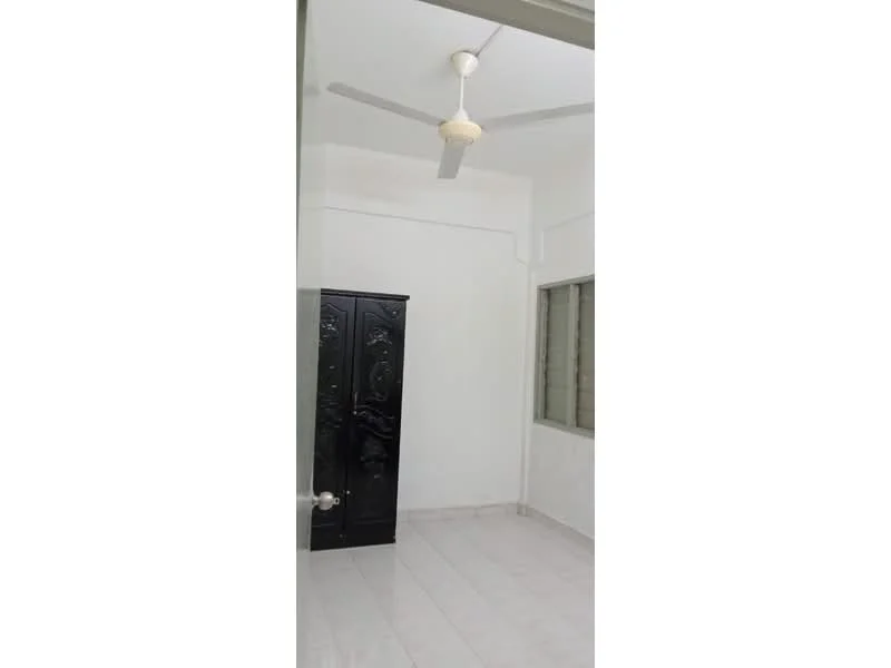 Room features: white painted walls, ceiling fan, black wardrobe, tile flooring, window with grille, neutral color scheme, corner space, natural light; style: minimalist.