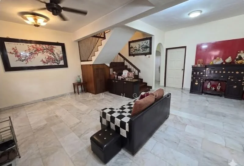 Living features: marble flooring, white painted walls, ceiling fan, wall-mounted artwork, wooden staircase, wooden railing, black console table, sofa with patterned upholstery, ottoman, decorative items on console, doorway leading to other rooms; style: traditional.