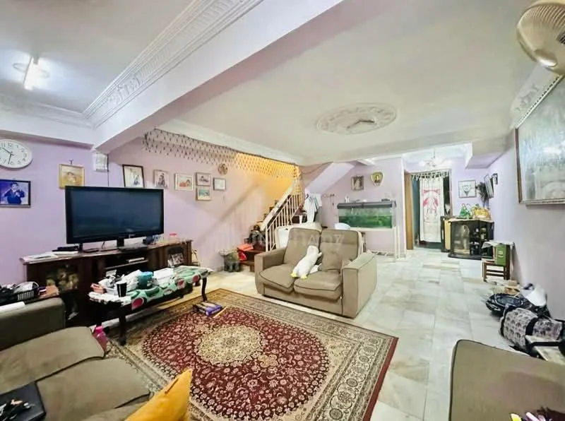Living features: cream painted walls, white ceiling with crown moulding, marble tile flooring, 3-seater fabric sofa in beige, area rug with intricate pattern, wall-mounted TV, coffee table, decorative wall clock, framed artwork on walls, staircase leading to upper floor, fish tank, ceiling fan; style: traditional.