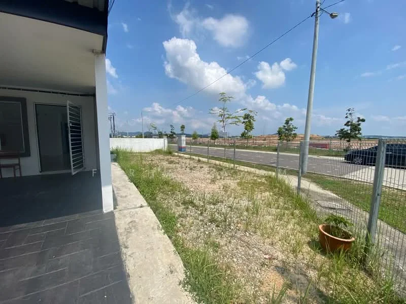 Exterior type: linked terrace house; features: concrete pathway, fenced perimeter, grassy area, paved road in front, street lighting, landscaped area with small plants, open space, nearby residential development; style: modern.