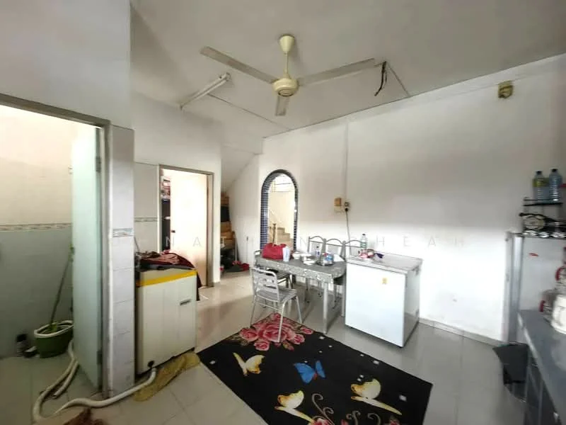 Kitchen features: white painted walls, tile flooring, 5-blade ceiling fan, dining table with chairs, refrigerator, kitchen cabinet, sink, countertop, decorative area rug. Room features: doorway leading to another room, tile flooring, white painted walls.