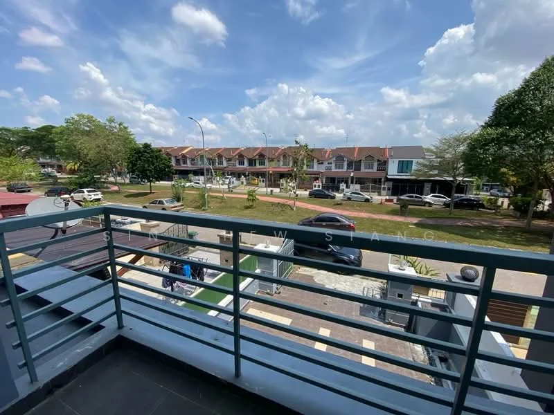 Room features: balcony with railing, grey tiled flooring, view of street, view of surrounding houses, greenery in the background, blue sky with clouds; view: street.