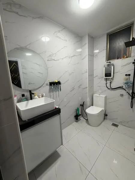 Bathroom features: white ceramic wall tiles with marble pattern, large round mirror, black countertop, white rectangular sink, one-piece toilet, shower with wall-mounted faucet, recessed ceiling lights, grey floor tiles, wall-mounted storage rack, window for natural light; style: modern.