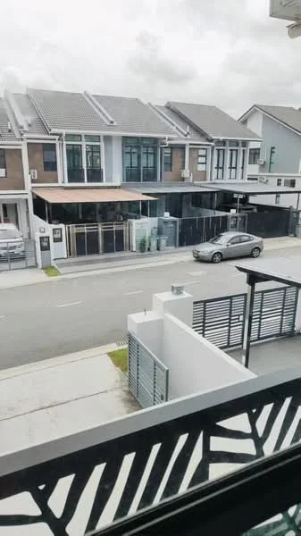 Exterior type: linked terrace house; features: two-storey linked terrace, grey painted facade, glass windows, balconies with railings, manicured lawn, paved driveway, street view, visible car parked, surrounded by residential area; style: modern.