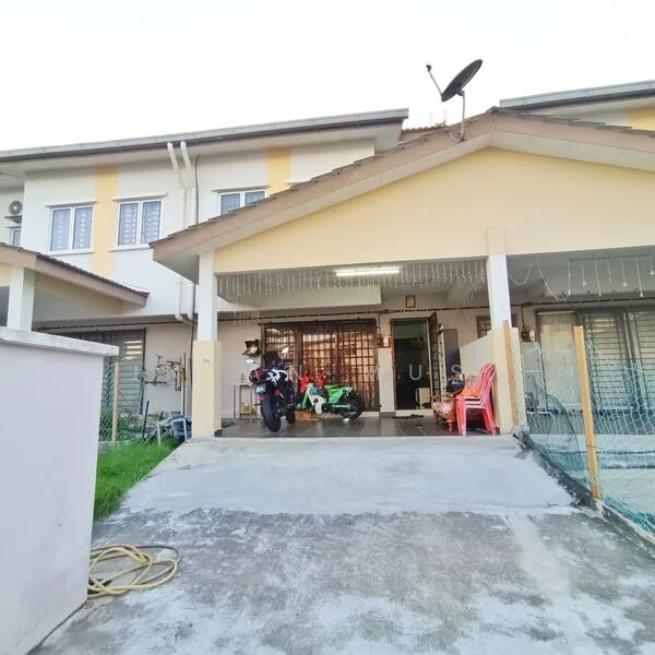 Exterior type: linked terrace house; features: single-storey, concrete driveway, manicured lawn, satellite dish on roof, front porch with seating, motorcycle parked, green motorcycle, red plastic chairs, fence surrounding property, exterior lights, decorative lights hanging; style: modern.