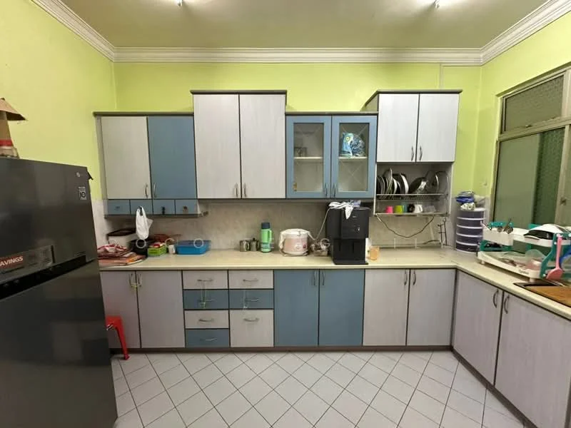 Kitchen features: light green painted walls, grey and blue cabinetry, laminate countertop, double-bowl stainless-steel sink, chrome pull-down faucet, built-in oven, freestanding refrigerator, tile flooring, window with metal grille, open shelving, dish rack, kitchen utensils, microwave, plastic storage containers; style: modern.
