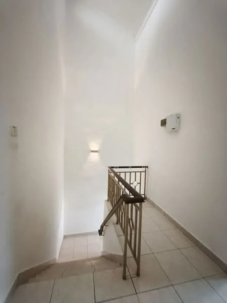 Room features: white painted walls, tile flooring, staircase with metal railing, wall-mounted light fixture, air conditioning unit, high ceiling; style: modern.