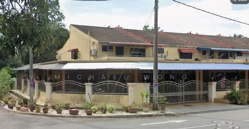 Exterior type: linked terrace house; features: two-storey building, cream painted facade, red tiled roof, front porch with railing, manicured garden with potted plants, multiple air conditioning units visible, gated entrance, street view, surrounded by greenery; style: traditional.