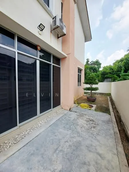 Exterior type: detached bungalow; features: glass sliding doors, exposed concrete flooring, air conditioning unit mounted on wall, manicured garden area, paved walkway, landscaped area with small tree, fenced yard, outdoor hose visible; style: modern.