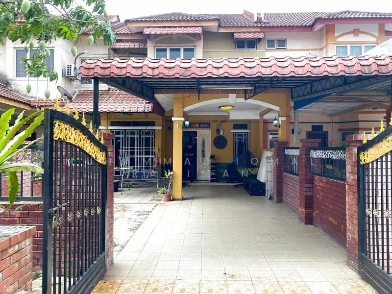 Exterior type: linked terrace house; features: red brick facade, yellow painted walls, pitched tile roof, gated entrance with wrought iron gate, paved driveway, manicured garden with plants, covered porch area, outdoor lighting fixtures, front yard with tiled flooring; style: modern.