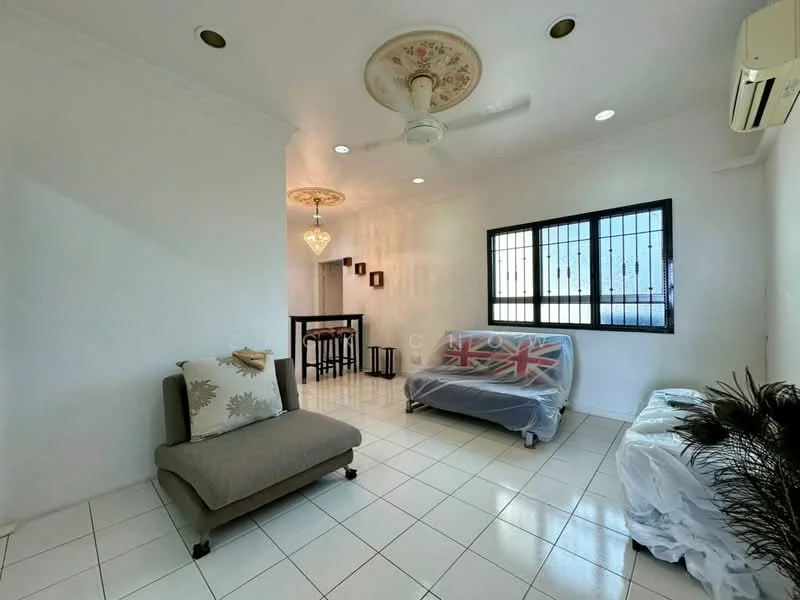 Living features: white painted walls, white tiled flooring, 5-blade ceiling fan with light, chandelier, sofa covered with protective cover, armchair with decorative pillow, window with security bars, decorative wall art, area rug, small side table; style: modern.