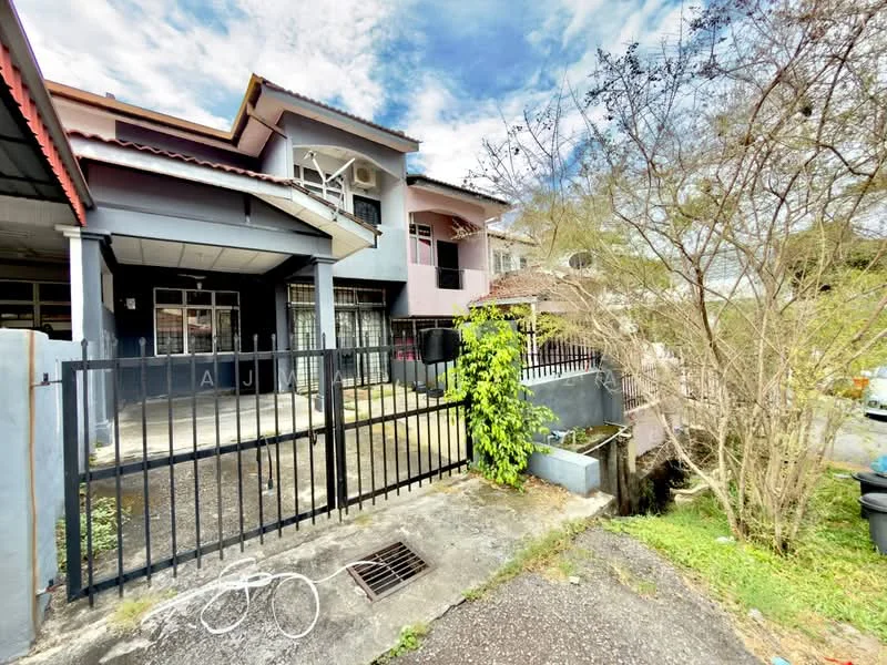 Exterior type: semi-detached house; features: grey painted facade, red tiled roof, black wrought iron fence, manicured lawn, paved driveway, front porch area, air conditioning units visible, mature trees, garden area, gutter system; style: modern.