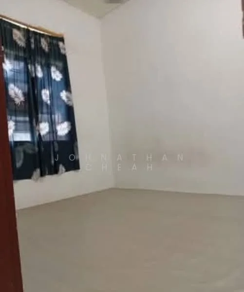 Room features: white painted walls, light-colored flooring, curtains with floral pattern, single window.