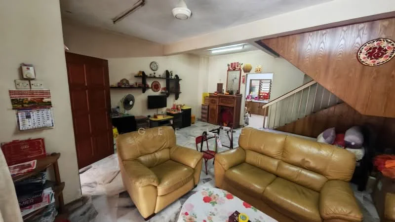 Living features: cream painted walls, marble flooring, 5-blade ceiling fan, 2-seater leather sofa in beige, coffee table with floral design, wall-mounted TV, wooden staircase, decorative wall plate, open shelving unit, desk with computer, wall clock, fan, calendar on wall; style: traditional.