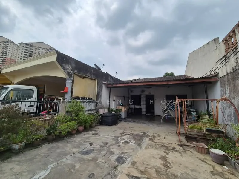 Exterior type: semi-detached house; features: concrete flooring, manicured garden with potted plants, covered car porch, exposed brick walls, roof overhang, metal gate, laundry area with drying rack, surrounding high-rise buildings, open outdoor space; style: traditional.