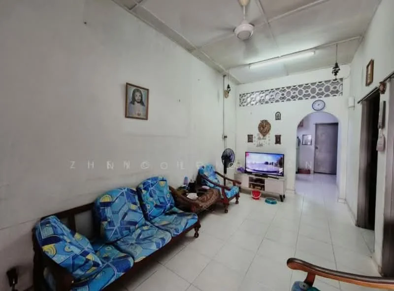 Living features: white painted walls, ceramic tile flooring, ceiling fan, wall-mounted TV, 2-seater fabric sofa in blue, 3-seater fabric sofa in blue, decorative wall art, floor fan, light fixture, arched doorway, decorative wall paneling; style: traditional.