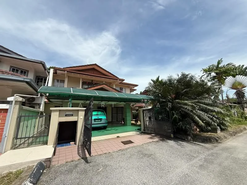 Exterior type: detached bungalow; features: green car porch with awning, brick facade, two-storey structure, manicured landscaping, palm trees, driveway with interlocking pavers, gated entry, front garden, sliding gate, visible vehicle in car porch; style: modern.