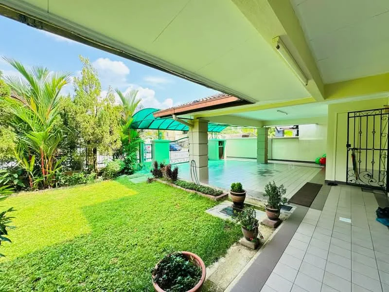 Exterior type: detached bungalow; features: manicured lawn, tropical landscaping, paved walkway, covered patio area, greenhouse structure, fenced perimeter, outdoor seating area, garden plants in pots; style: modern.