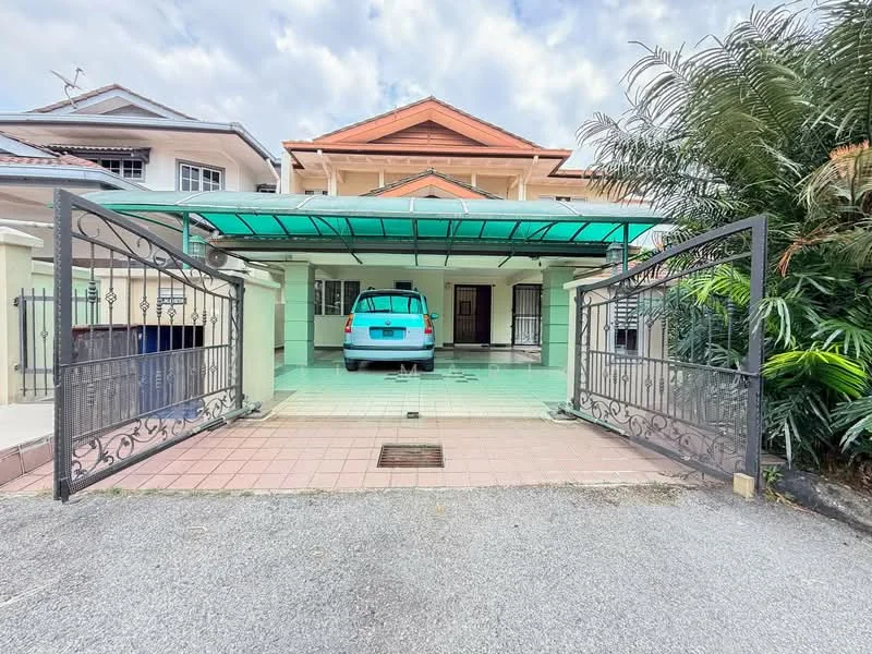 Exterior type: linked terrace house; features: green awning over car porch, paved driveway, metal gate, manicured landscaping, palm trees, two-storey structure, front porch area, visible car in car porch, cream painted facade, red tiled roof; style: modern.