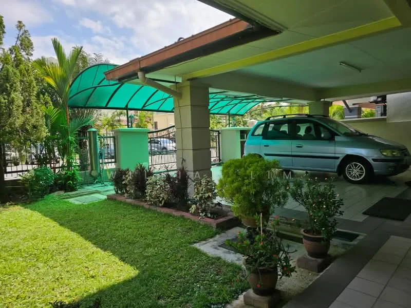 Exterior type: detached bungalow; features: car porch with awning, manicured lawn, tropical landscaping, paved walkway, flower pots with plants, green canopy, fenced perimeter, driveway, single-storey structure; style: modern.