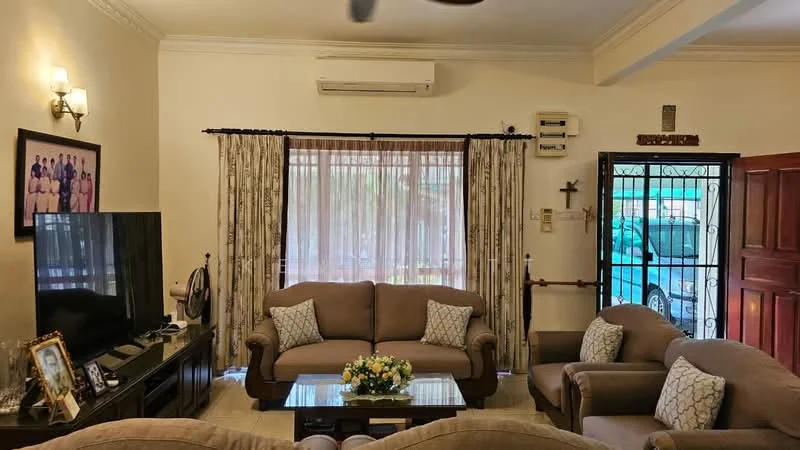 Living features: 3-seater fabric sofa in beige, 2-seater fabric sofa in beige, glass coffee table, wall-mounted TV, wooden TV console, curtains with floral pattern, air conditioning unit, ceiling fan, framed artwork on wall, decorative vase with flowers, wooden door, cross wall decor; style: traditional.