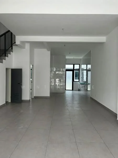 Room features: grey tiled flooring, white painted walls, large windows providing natural light, open layout, high ceiling, staircase visible in the background, metal railing on staircase, minimalist design; style: modern.