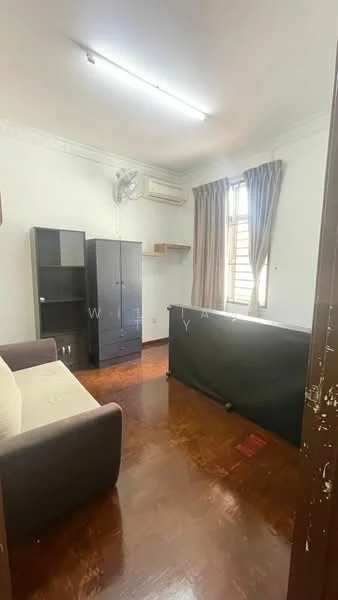 Room features: wooden flooring, white painted walls, 1 wall-mounted split AC, curtains on window, sofa, black cabinet, shelf above cabinet, light fixture on ceiling.