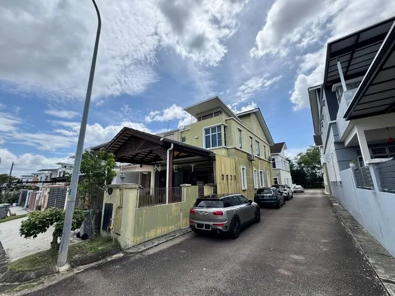 Exterior type: detached bungalow; features: yellow painted facade, two-storey building, gabled roof, covered porch, driveway with multiple vehicles, manicured landscaping, street lamp, cloudy sky, surrounded by greenery; style: modern.