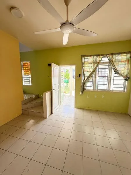 Living features: cream tiled flooring, yellow painted walls, white ceiling, 5-blade ceiling fan, floor-to-ceiling windows, curtains with floral pattern, white door leading outside, staircase with tiled steps; view: garden.