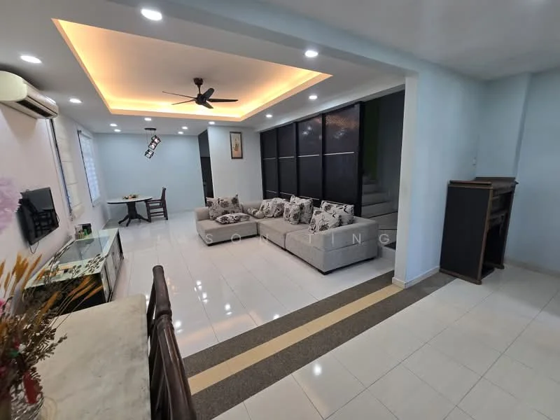Living features: L-shape sectional sofa in light grey, decorative cushions, ceiling fan with light, recessed lighting, white painted walls, glossy tile flooring, wall-mounted air conditioning unit, coffee table, TV console, dining table with chairs visible in background, staircase leading to upper floor, large windows for natural light; style: modern.