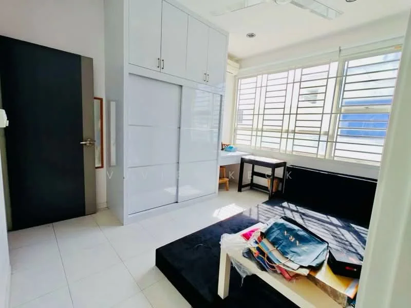 Room features: white painted walls, tile flooring, built-in wardrobe with sliding doors, large windows with horizontal slats, black sofa, small study table, ceiling fan, natural light from windows, decorative items on table; style: modern.