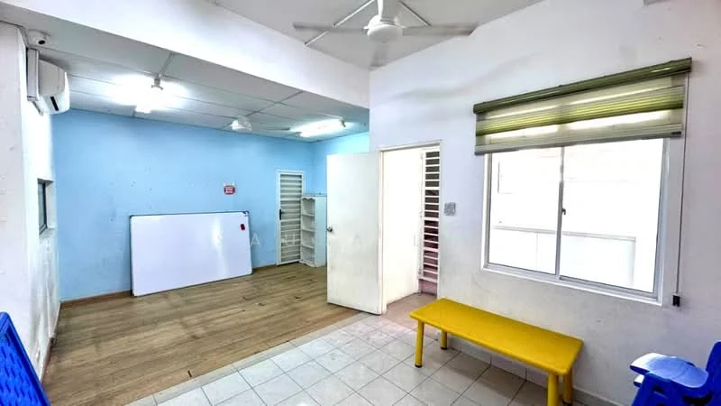 Room features: light blue painted walls, white tiled flooring, wooden flooring, 1 wall-mounted split AC, ceiling fan, window with green roller blinds, white door, yellow bench, whiteboard, shelving unit, open layout; style: modern.