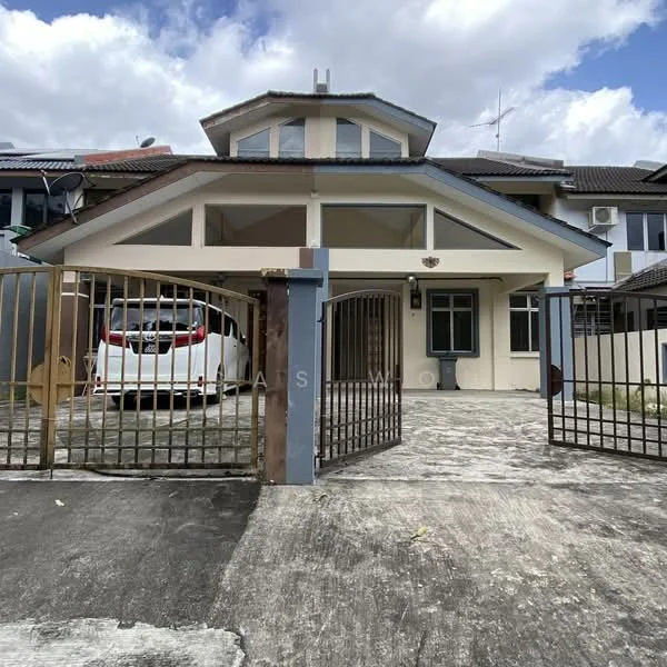 Exterior type: semi-detached house; features: two-storey structure, cream painted facade, gabled roof, front porch with carport, metal gate, concrete driveway, manicured lawn, visible air conditioning units, surrounded by residential buildings, paved walkway; style: modern.