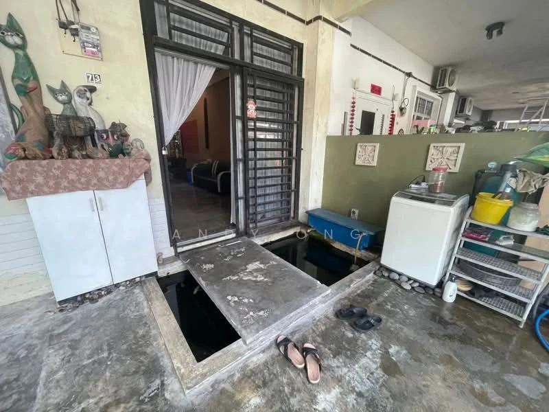 Room features: concrete flooring, sliding glass door, white curtains, washing machine, storage cabinet, decorative figurines, open space layout, visible plumbing access, outdoor transition area; style: modern.