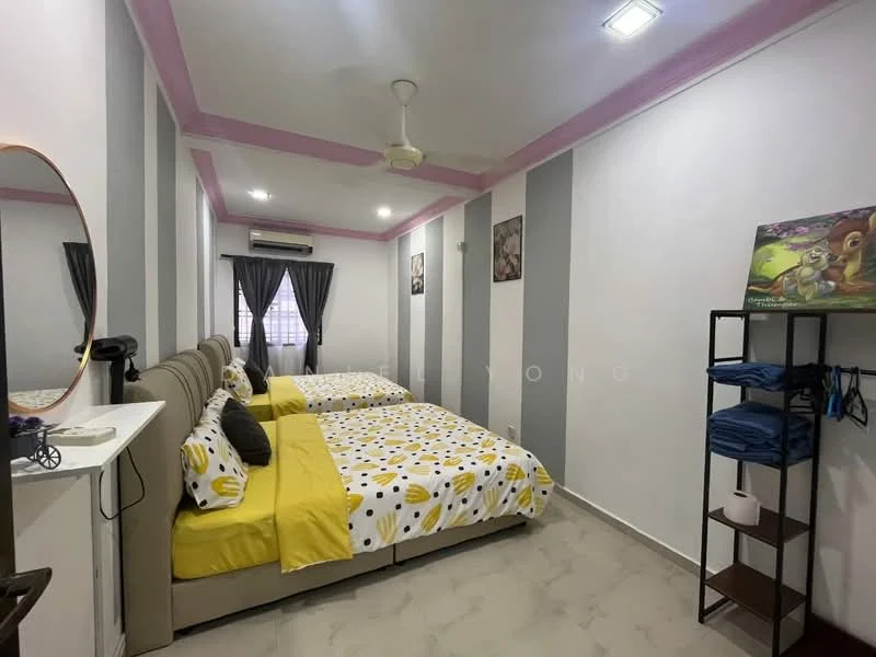 Bedroom features: two single beds with yellow and white bedding, decorative pillows, grey accent wall, white painted walls, ceiling fan, recessed ceiling lights, window with sheer curtains, mirror on wall, wooden shelving unit, stacked towels on shelf, wall art, air conditioning unit; style: modern.
