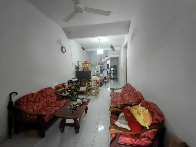 Living features: red patterned fabric sofa, 2-seater wooden sofa, wooden coffee table, white tiled flooring, ceiling fan, wall clock, decorative items on shelves, open layout to dining area, light fixture hanging from ceiling, umbrella in corner.