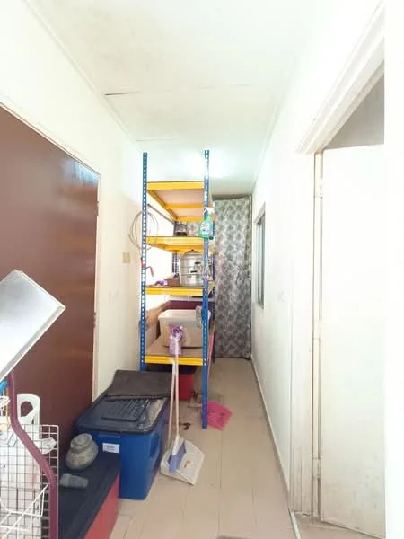Hallway features: white painted walls, tile flooring, shelving unit with yellow shelves, window with curtain, storage boxes, cleaning supplies, mop, broom, metal door, door frame, light fixture.