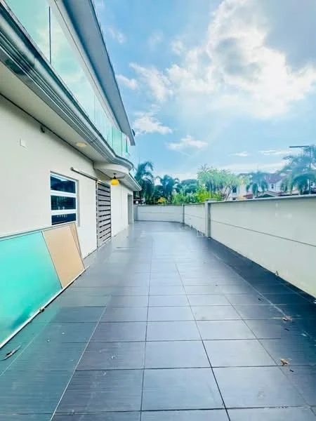 Exterior features: large outdoor terrace, grey tiled flooring, glass railing, white painted walls, surrounded by greenery, clear blue sky; style: modern.