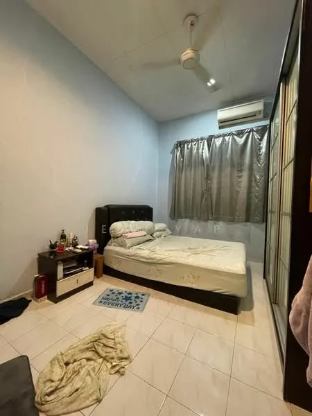 Bedroom features: queen-size bed, upholstered headboard, bedside table, wall-mounted split AC, 5-blade ceiling fan, grey curtains, white painted walls, tile flooring, decorative rug, clothing on the floor, pillow and bedding on the bed.