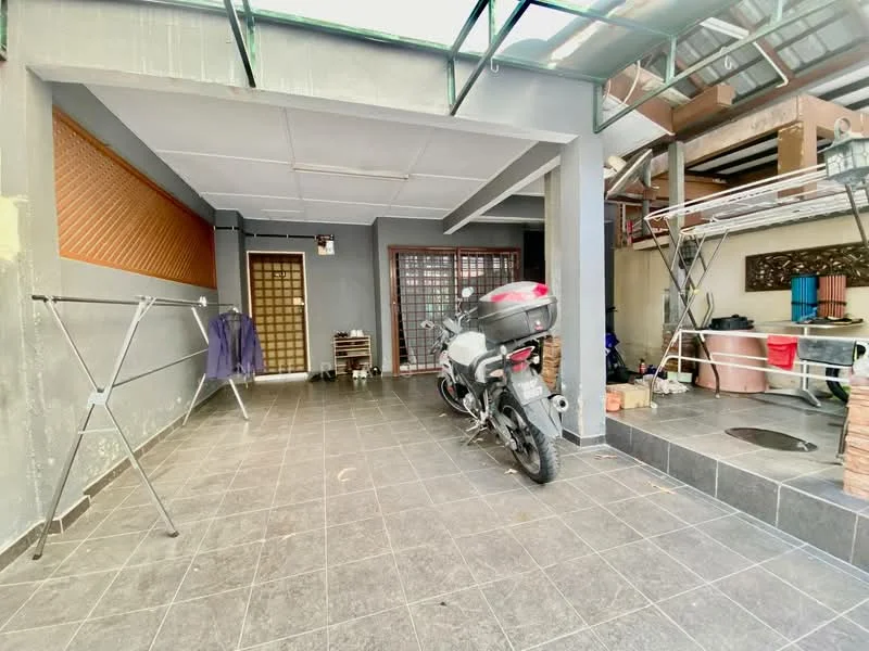 Exterior type: linked terrace house; features: covered car porch, grey tiled flooring, motorcycle parked, exposed brick wall, wooden door with grid pattern, metal roof, clothes drying rack, storage area with stacked bricks; style: modern.