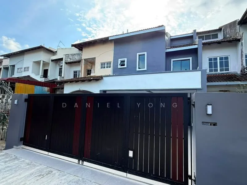 Exterior type: linked terrace house; features: two-storey building, painted facade in grey and white, metal gate with horizontal slats, front driveway, windows with white frames, roof with overhang, visible neighboring houses, concrete pathway; style: modern.