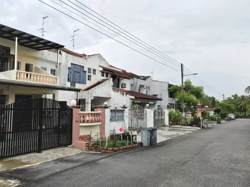 Exterior type: linked terrace house; features: white painted facade, red tiled roof, gated entrance, paved driveway, manicured lawn, street view, multiple storeys, balconies, fence with decorative gates, outdoor lighting, surrounded by greenery; style: modern.